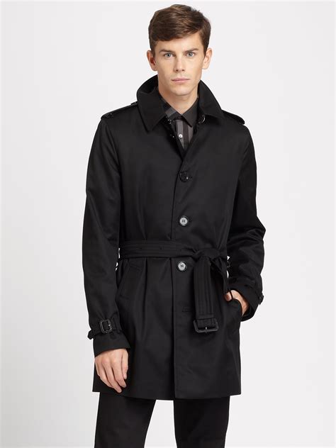 single breasted black trench coat.